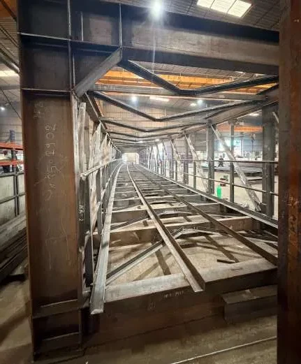 Curved pipe-conveyor galleries