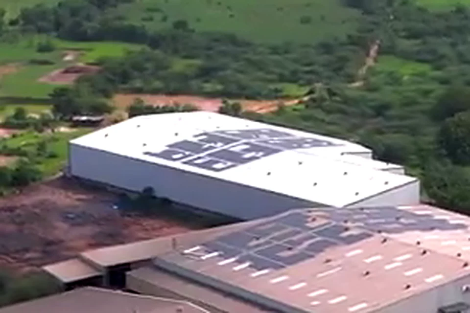 Allmarc Scafform at Kanbha from the air: a white shed with solar panels on its roof